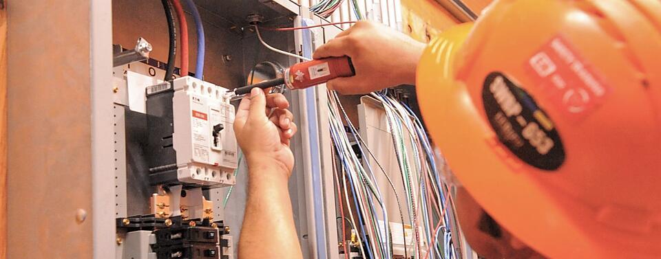 Correct Electric technician fixing electrical system